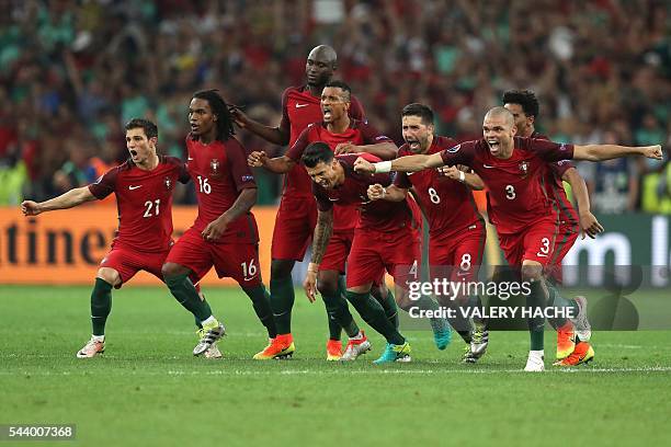 Portugal's players celebrate after winning the Euro 2016 quarter-final football match between Poland and Portugal at the Stade Velodrome in Marseille...