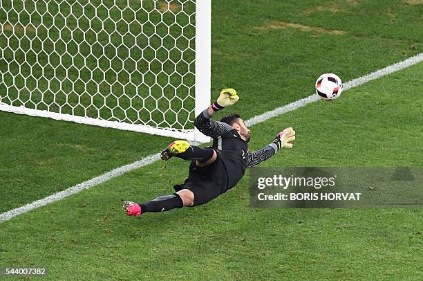 Portugal's goalkeeper Rui Patricio stops a penalty shot by Poland's midfielder Jakub Blaszczykowski during the Euro 2016 quarter-final football match...