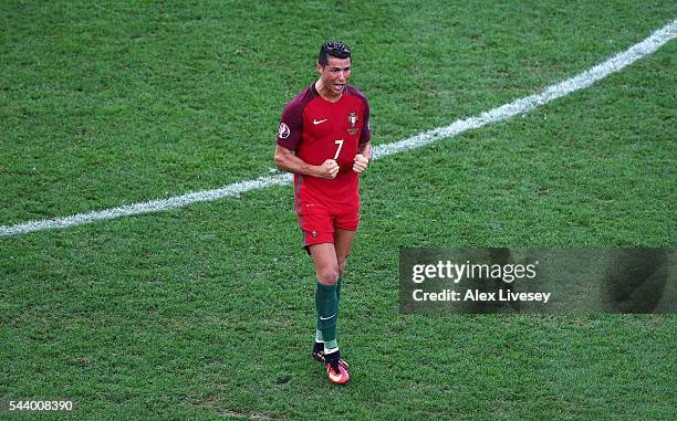 Cristiano Ronaldo of Portugal celebrates his team mate Rui Patricio saves a penalty by Jakub Blaszczykowski of Poland during the penalty shootout...