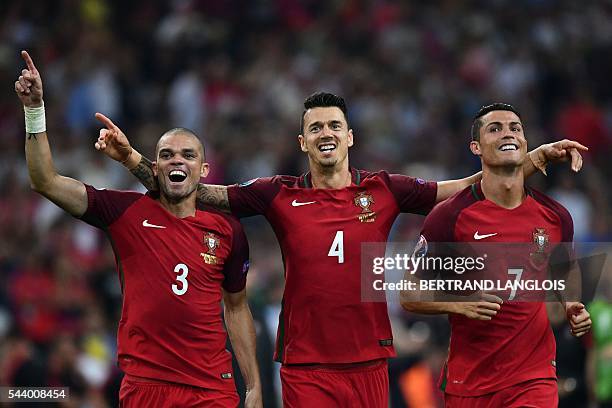 Portugal's defender Pepe, Portugal's defender Fonte and Portugal's forward Cristiano Ronaldo celebrate after winning the Euro 2016 quarter-final...