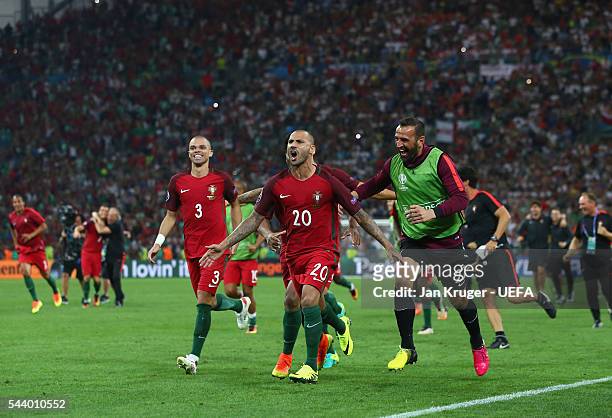 Ricardo Quaresma of Portugal celebrates scoring at the penalty shootout to win the game with his team mates after the UEFA EURO 2016 quarter final...