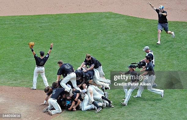 Coastal Carolina Chanticleers run out onto the field after defeating the Arizona Wildcats 4-3 to win the National Championship at the College World...