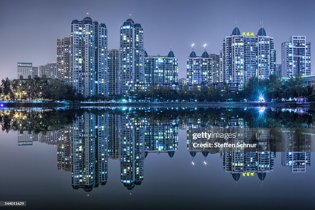 Nature and city mirrored skyline at sea China