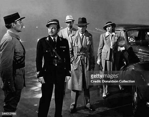 Actors Humphrey Bogart, Paul Henreid, Claude Rains and Ingrid Bergman pose for a publicity still for the Warner Bros film 'Casablanca' in 1942 in Los...