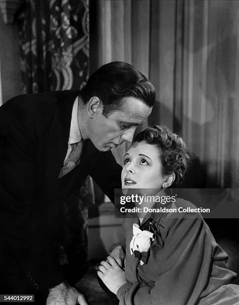 Actors Humphrey Bogart and Mary Astor pose for a publicity still for the Warner Bros film 'The Maltese Falcon' in 1941 in Los Angeles, California.