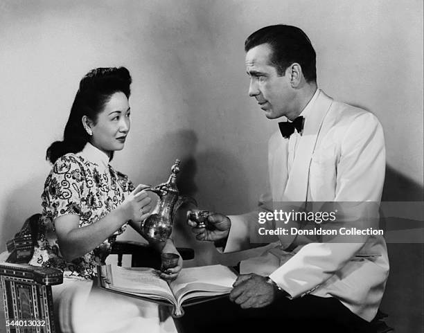Actors Humphrey Bogart and Melie Chang pose for a publicity still for the Warner Bros film 'Casablanca' in 1942 in Los Angeles, California.