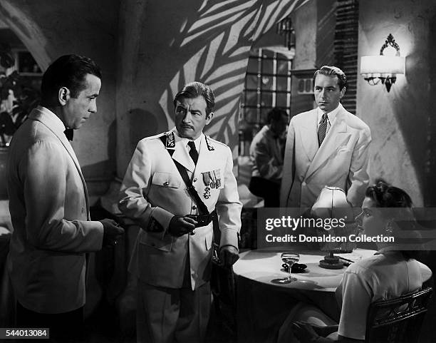 Actors Humphrey Bogart, Paul Henreid, Claude Rains and Ingrid Bergman pose for a publicity still for the Warner Bros film 'Casablanca' in 1942 in Los...