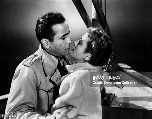 Actors Humphrey Bogart and Mary Astor pose for a publicity still for the Warner Bros film 'Across the Pacific' in 1942 in Los Angeles, California.