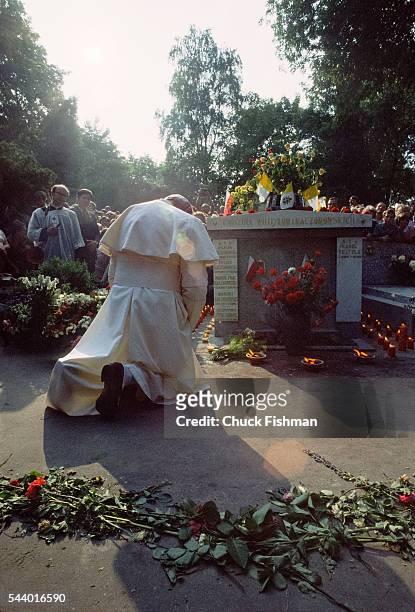 At Rakowicki cemetery, Pope John Paul II prays at the graves of his parents and brother, Krakow, Poland, early June, 1979.