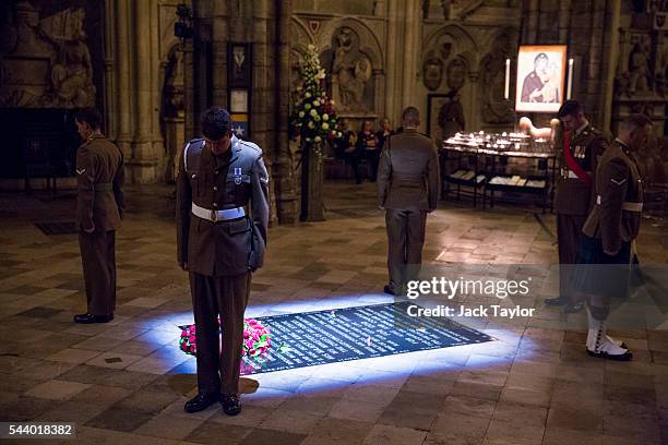 British Military personnel LBdr Walsh, LCpl Drury, LCpl Kinmond, Cpl Wolfe and Sgt Cohoon stand at the Grave of the Unknown Warrior during a vigil to...