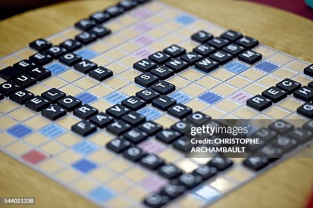 This picture taken on June 30, 2016 shows letters placed on a board during a game of Scrabble during the King's Cup tournament - the globe's biggest...