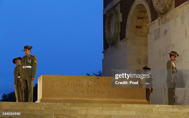 View of soldiers standing at the Stone of Rememberance during a military-led vigil to commemorate the 100th anniversary of the beginning of the...