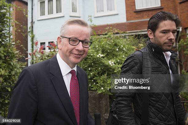 Michael Gove, U.K. Justice secretary, left, reacts as he leaves his home in London, U.K., on Friday, July 1, 2016. Hours after his announcement, Gove...