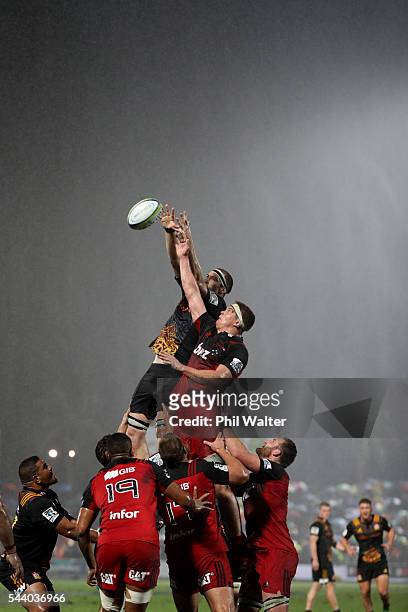 Brodie Retallick of the Chiefs and Scott Barrett of the Crusaders contest the lineout during the round 15 Super Rugby match between the Chiefs and...