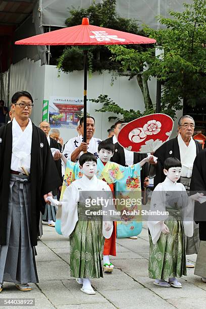 Ryushin Kumeda, acts as 'Chigo' attends the 'Osendo-no-Gi' ritual to pray for the sucess as the start of the Kyoto Gion Festival at the Yasaka Jinja...