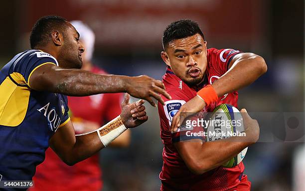 Hendrik Tui of the Reds offloads during the round 15 Super Rugby match between the Brumbies and the Reds at GIO Stadium on July 1, 2016 in Canberra,...