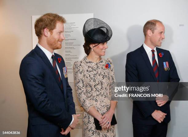 Britain's Prince William , his wife Catherine Duchess of Cambridge and Prince Harry smile inside the World War I Thiepval monument, northern France,...