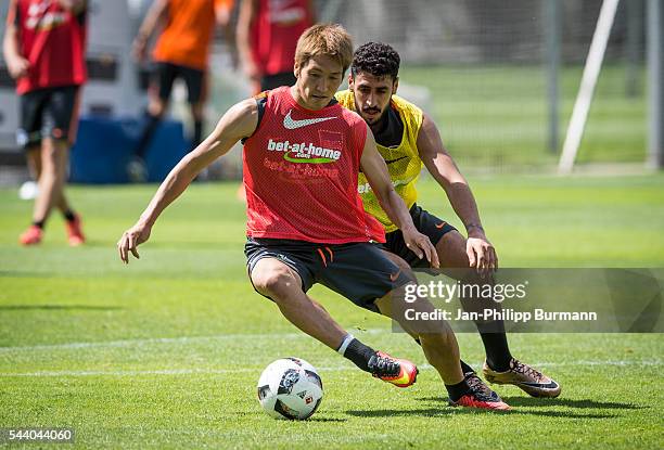 Genki Haraguchi, Tolga Cigerci of Hertha BSC during the training session at Schenkendorfplatz on July 01, 2016 in Berlin, Germany.