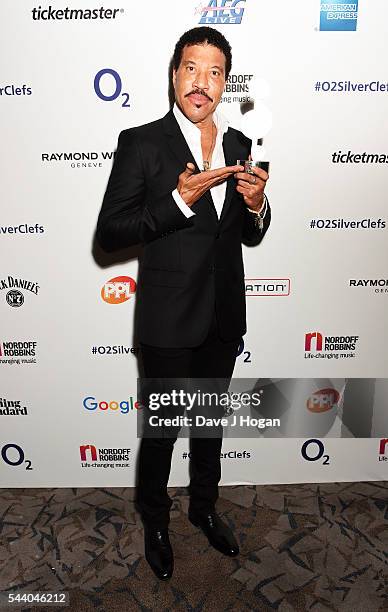Lionel Richie poses with the O2 Silver Clef Award during the Nordoff Robbins O2 Silver Clef Awards on July 1, 2016 in London, United Kingdom.