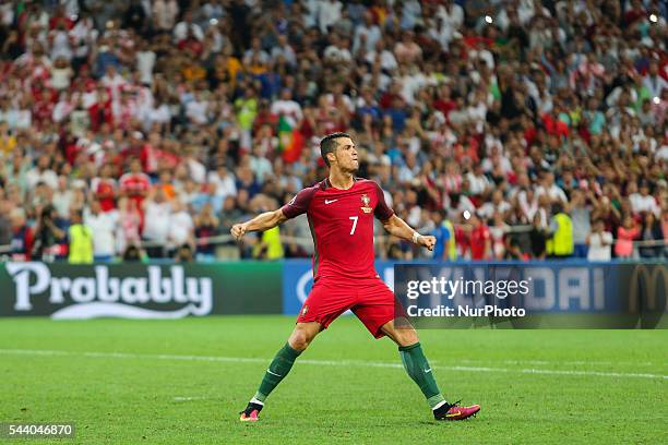 Cristiano Ronaldo of Portugal celebrates his team mate Rui Patricio saves a penalty by Jakub Blaszczykowski of Poland during the penalty shootout...