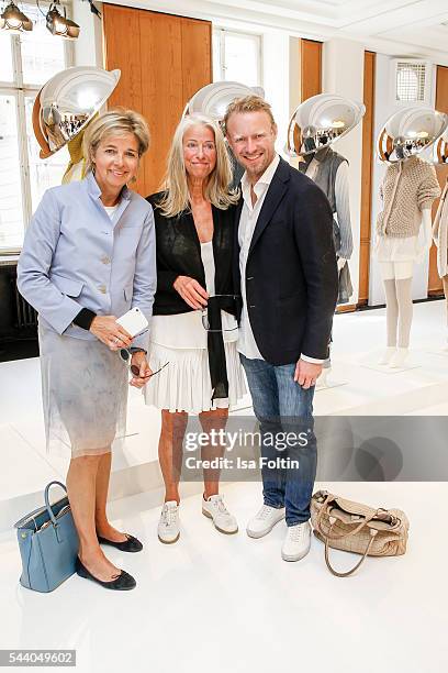 Inga Griese-Schwenkow, Fashion Designer Iris von Arnim and her son Valentin von Arnim attend the group presentation during the Der Berliner Mode...