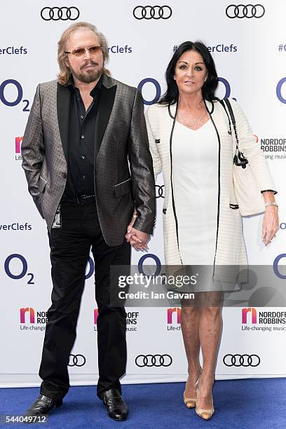 Barry Gibb and Linda Gibb attend the Nordoff Robbins O2 Silver Clef Awards at The Grosvenor House Hotel on July 1, 2016 in London, England.