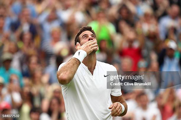 Juan Martin Del Potro of Argentina celebrates victory during the Men's Singles second round match against Stan Wawrinka of Switzerland on day five of...