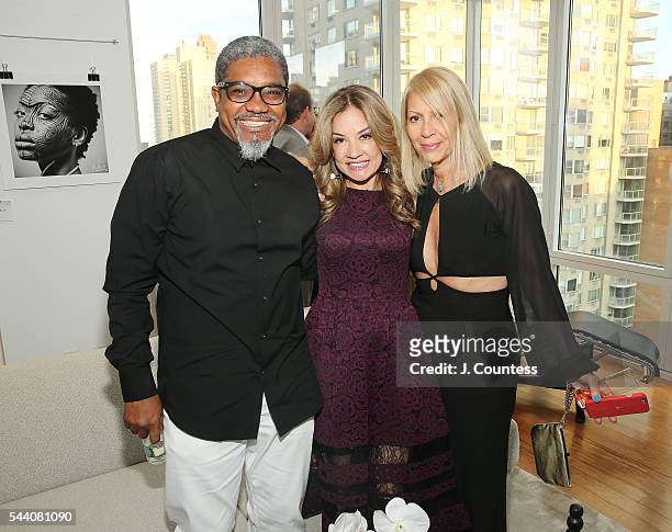 Photographer Marc Baptiste, Maria Moraes and Rona Siegel pose for a photo at the "Other Color" By Marc Baptiste Opening at the apART Private Gallery...