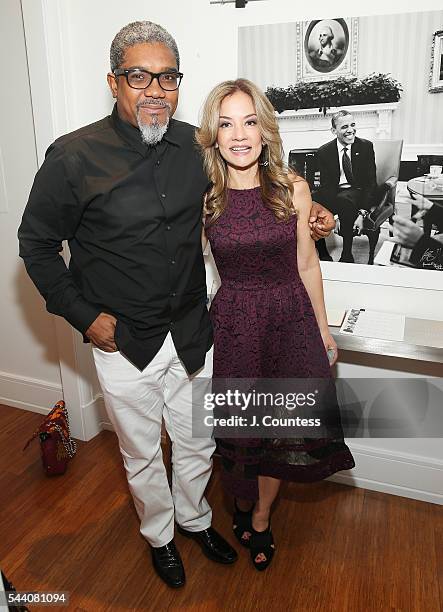 Photographer Marc Baptiste and Maria Moraes pose for a photo at the "Other Color" By Marc Baptiste Opening at the apART Private Gallery on June 30,...