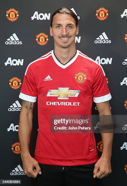 Zlatan Ibrahimovic of Manchester United poses after signing for the club at Aon Training Complex on July 1, 2016 in Manchester, England.