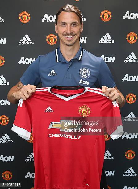 Zlatan Ibrahimovic of Manchester United poses after signing for the club at Aon Training Complex on July 1, 2016 in Manchester, England.