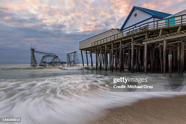 jet star roller coaster and casino pier in seaside heights, new jersey - seaside heights fotografías e imágenes de stock