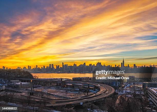 stormy morning cloudy sky sunrise. manhattan skyline from new jersey looking over hudson river and lincoln tunnel. - hudson river stock pictures, royalty-free photos & images