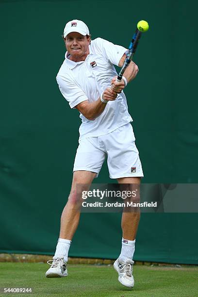 Matthew Barton of Australia plays a backhand during the Men's Singles second round match against John Isner of The United States on day five of the...