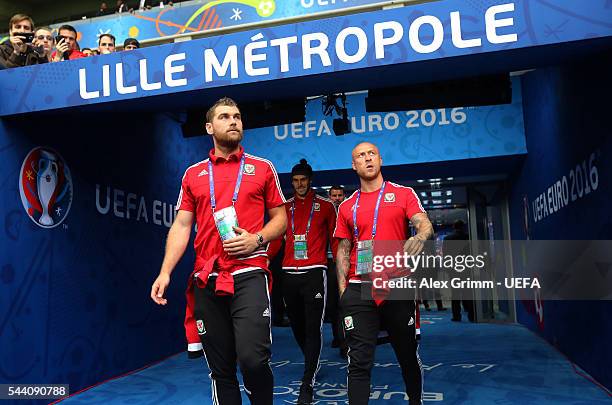 Sam Vokes and David Cotterill of Wales walk out the tunnel for the pitch inspection prior to the UEFA EURO 2016 quarter final match between Wales and...