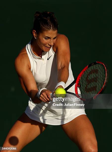 Mandy Minella of Luxembourg plays a backhand during the Ladies Singles second round match against Sloane Stephens of The United States on day five of...