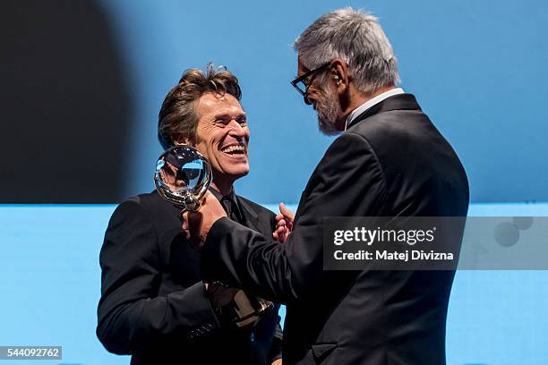 Actor Willem Dafoe receives the Crystal Globe Award for Outstanding Artistic Contribution to World Cinema from President of Karlovy Vary...