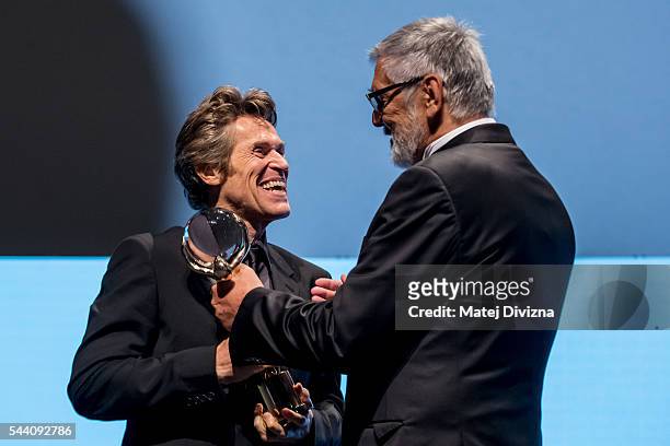Actor Willem Dafoe receives the Crystal Globe Award for Outstanding Artistic Contribution to World Cinema from President of Karlovy Vary...