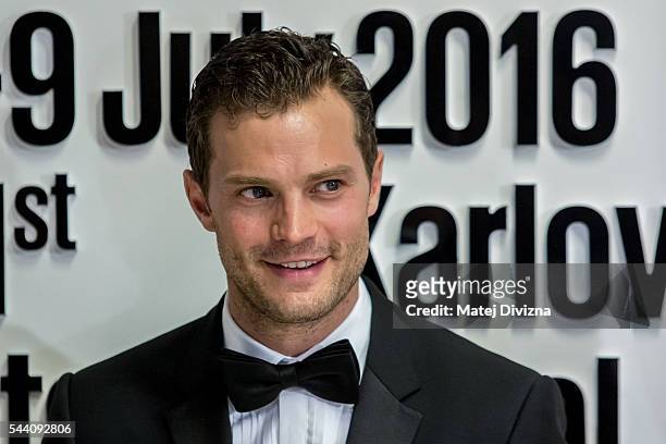 Actor Jamie Dornan poses for photographers at the opening ceremony of the 51st Karlovy Vary International Film Festival on July 1, 2016 in Karlovy...