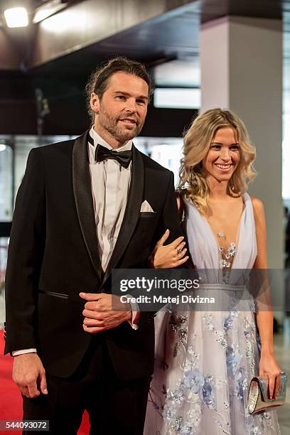 Hockey player Jaromir Jagr and his girlfriend Veronika Koprivova pose for photographers as they arrive at the opening ceremony of the 51st Karlovy...