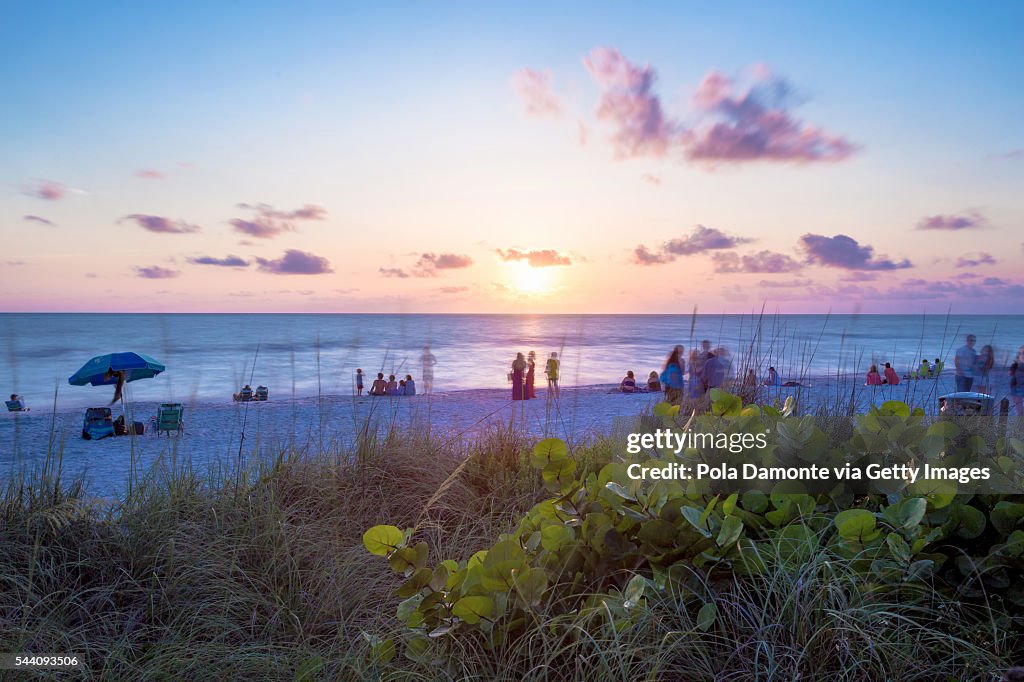 Beach sunset with a pristine and idyllic beach in Naples, Florida, USA