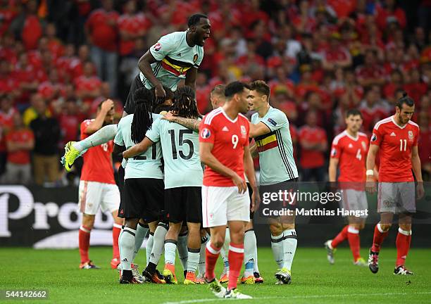 Belgium players celebrate their team's first goal by Radja Nainggolan during the UEFA EURO 2016 quarter final match between Wales and Belgium at...