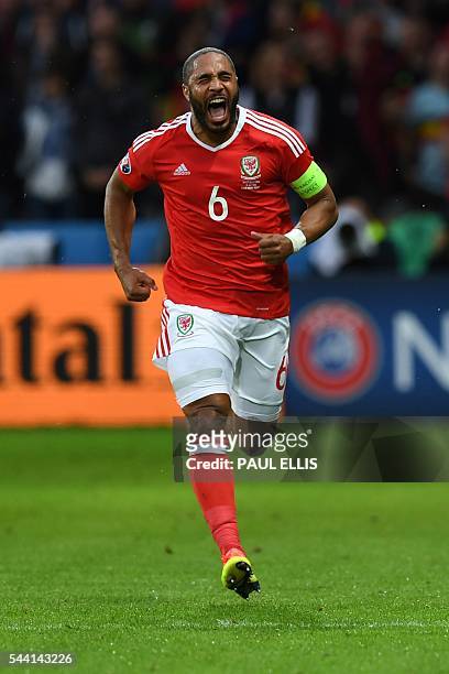 Wales' defender Ashley Williams celebrates after scoring a goal during the Euro 2016 quarter-final football match between Wales and Belgium at the...
