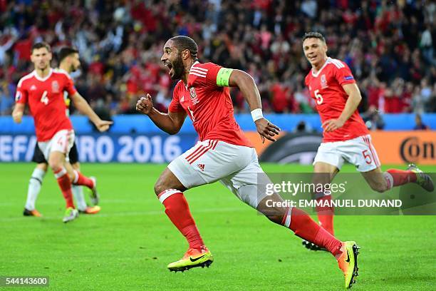 Wales' defender Ashley Williams celebrates after scoring a goal during the Euro 2016 quarter-final football match between Wales and Belgium at the...