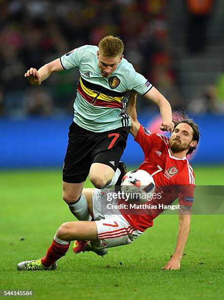 Kevin De Bruyne of Belgium is tackled by Joe Allen of Wales during the UEFA EURO 2016 quarter final match between Wales and Belgium at Stade...
