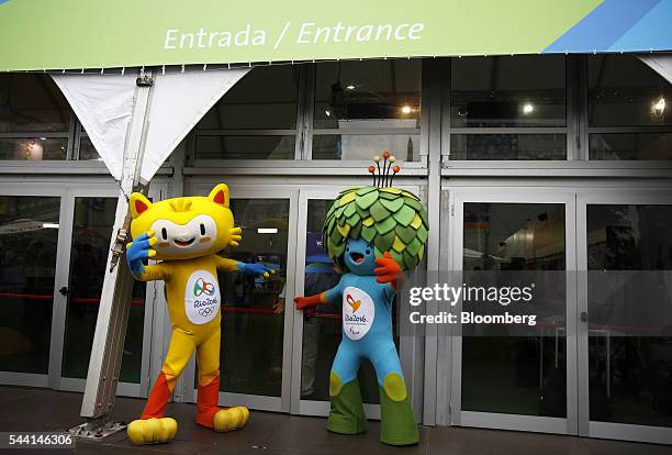 Mascots for the Rio 2016 Olympic games greet customers during the opening of Brazil's Cocacabana Olympic megastore in Rio De Janeiro, Brazil, on...