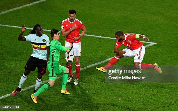 Thibaut Courtois of Belgium saves the shot by Ashley Williams of Wales during the UEFA EURO 2016 quarter final match between Wales and Belgium at...