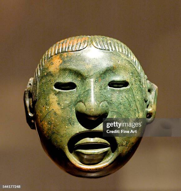 Pendant-mask associated with the rituals of Aztec god Xipe Totec. Stone, Mexico Valley, 15th century?before 1521. Height: 10.9 cm . Located in Musee...