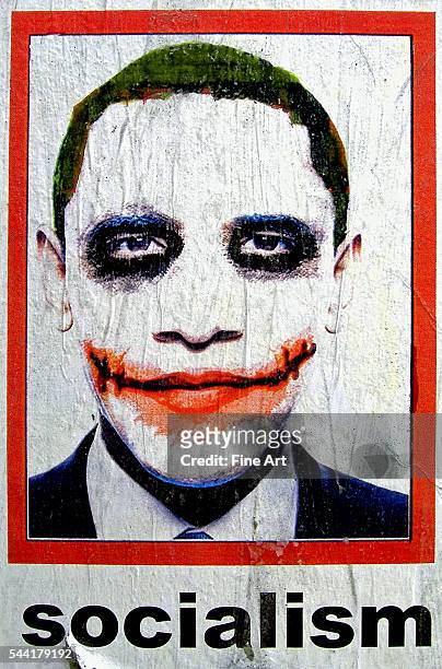 Racist "Tea Party" poster protesting President Obama as a Socialist, with a caricature of Obama in white face and painted as "The Joker." 2010.