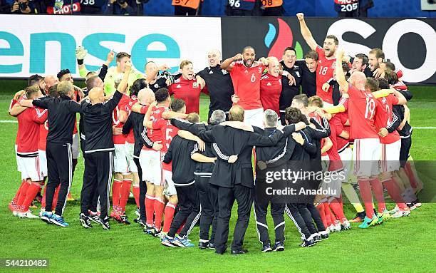 Players of Wales celebrate the victory following the UEFA Euro 2016 quarter final match between Wales and Belgium at Stade Pierre-Mauroy on July 1,...